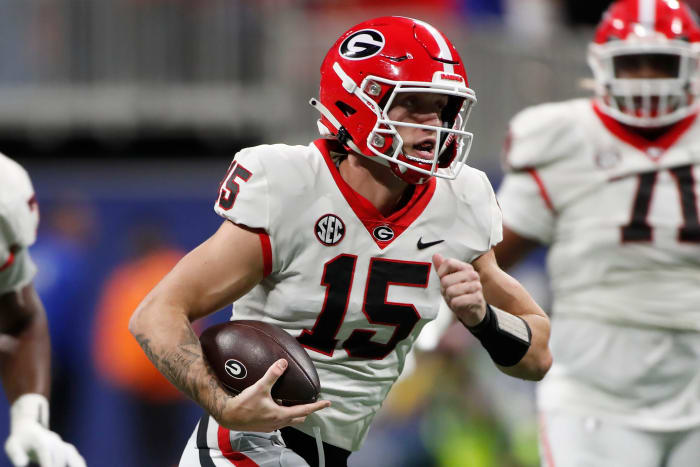 Georgia quarterback Carson Beck (15) runs the ball during the first half of the SEC Championship game against Alabama at Mercedes-Benz Stadium in Atlanta, on Saturday, Dec. 2, 2023.